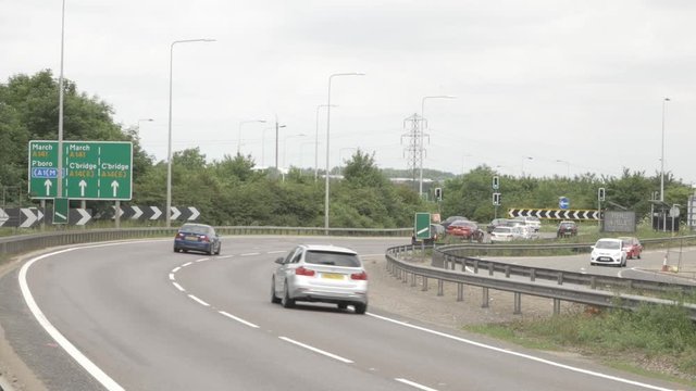 A14 road sign with cars driving by