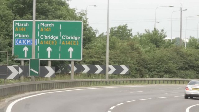 A14 road sign with cars driving by