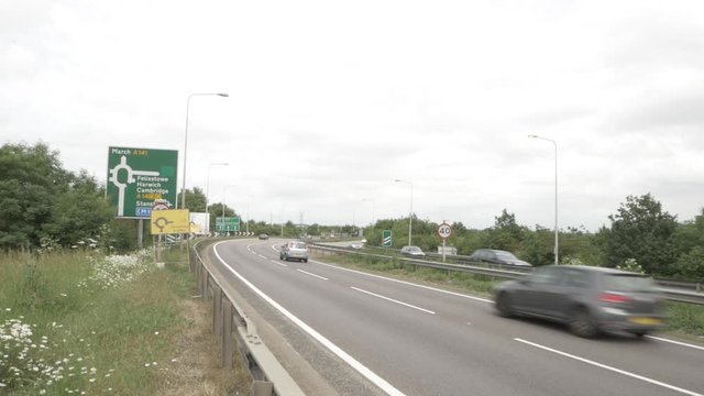 A14 road sign with cars driving by