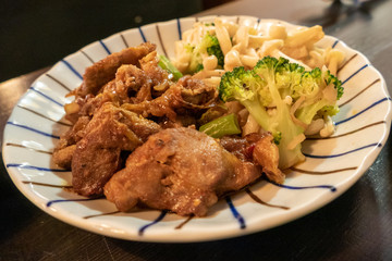 Chinese pork dish on table with side dishes