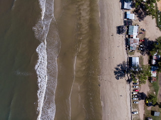 Beautiful Tropical beach with sea and palm taken from drone