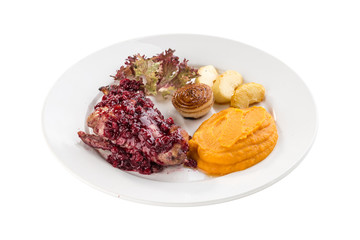 duck breast roasted with sweet cranberry sauce and mashed squash isolated on white background