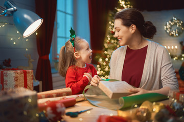 Mother and child packing gifts