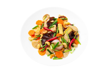 Closeup plate of traditional thai food - stir fried chicken with cashew nuts isolated at white background.