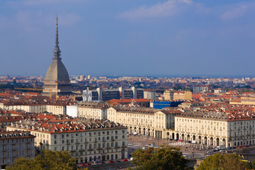 The view of Turin,Italy with  the symbol  monument the Mole Antonelliana  and a glimpse of square Vittorio Veneto with arched porticoes