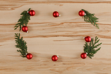 Fototapeta na wymiar Flat background with wooden desk board top with christmas decorations and ornaments.