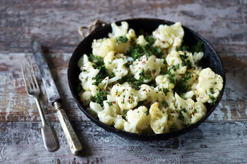 Baked cauliflower with spices and olive oil. Vegan diet. Healthy food. Selective focus. Macro.
