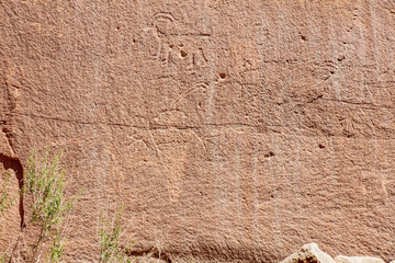 Ancient Fremont People petroglyphs make present day visitor aware of their existence oin the sandstone walls of Capitol Reef National Park, Utan