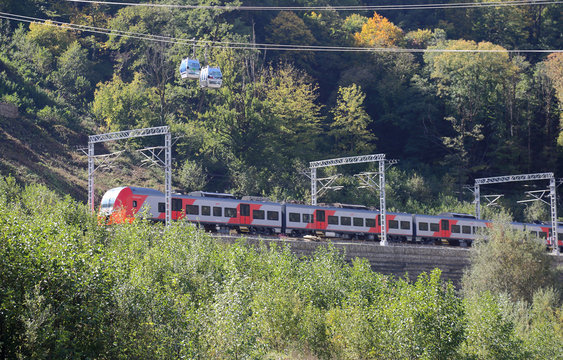 Suburban electric train Lastochka moves in the resort of Krasnaya Polyana. Sochi, Russia