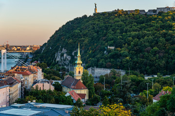 Fototapeta premium Budapest, Hungary - October 01, 2019: Saint Catherine of Alexandria Church and Gellert Hill in Budapest.
