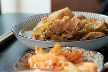 Chinese pork dish on table with side dishes