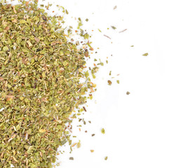 a pile of dried oregano on a white background