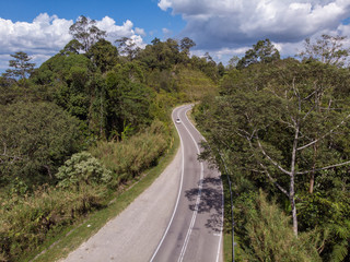 Top view of the the rainforest asphalt road in Sabah, Borneo