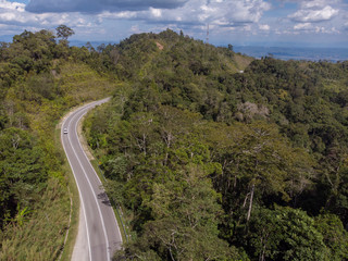 Fototapeta na wymiar Top view of the the rainforest asphalt road in Sabah, Borneo