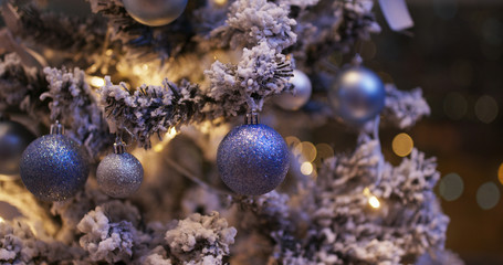 Naklejka na ściany i meble Christmas tree decoration with light in blue color at night