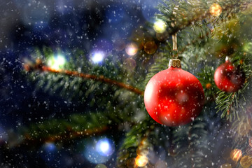 Christmas decorations in bright blue red gold  and white shiny and shimmering colors with Christmas lights with blurred background. 