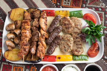 Middle Eastern Style Assorted Grilled Meat, Kebabs, Beef, Lamb, Chicken and Vegetables.