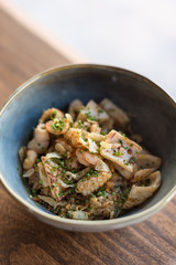 Bowl of Seafood Fried Rice Garnished with Chives.