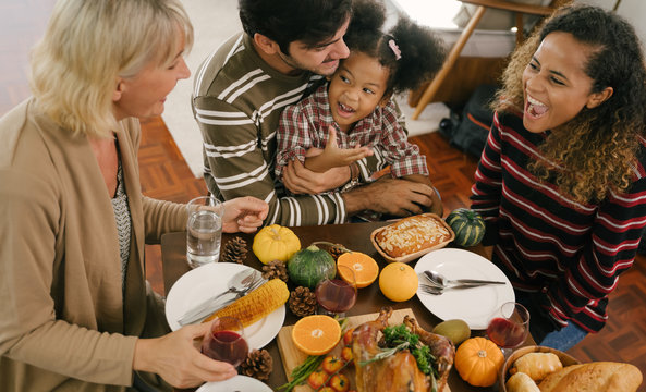 Happy Family Celebrating Thanksgiving Dinner at home . Celebration tradition concept