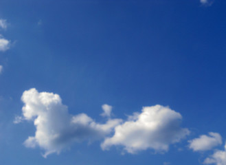 Lush clouds in the blue sky, not the usual form. Beautiful cloudy landscape.          