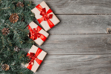 Christmas gift box. Christmas presents in boxes at white wooden table. Flat lay with copy space.