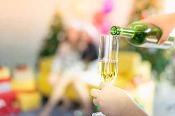 Celebration party group of Asian cheerful attractive young woman in Santa Claus hat holding champagne glass happy and funny concept. In 2020 New year holiday. Selective focus.
