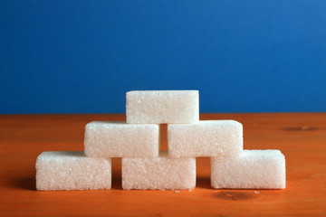 Composition of sugar cubes in the shape of a brick wall.