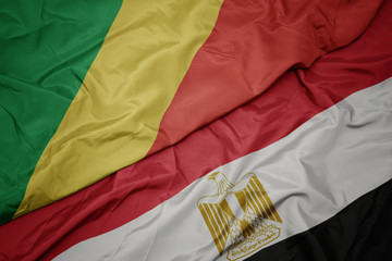 waving colorful flag of egypt and national flag of republic of the congo.