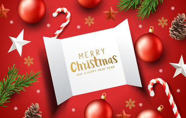 Open advent calendar doors surrounded by christmas decorations.