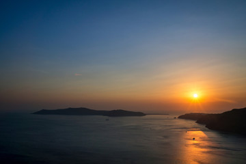 Sunset over the city of Oia in Santorini.