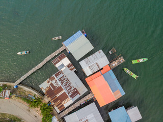 Top down aerial view of the local lifestyle traditional water village houses in a small village Beside sea at Kudat, Sabah, Borneo. 