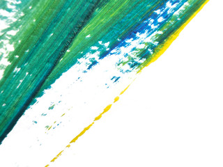 The blue, green and yellow acrylic painting with color texture on white paper background by using...