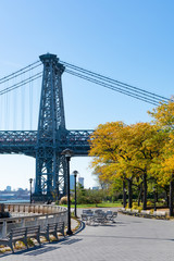 Walkway along the East River Park by the Williamsburg Bridge on the Lower East Side of New York City during Autumn
