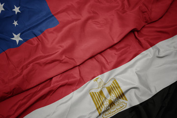 waving colorful flag of egypt and national flag of Samoa .