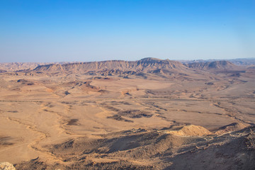 Fototapeta na wymiar View of the sandy hills and mountains of Ramon Crater