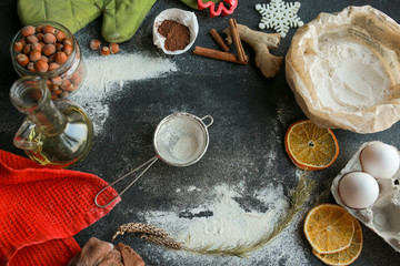 The process of making christmas cookies. Girl hands make the dough. Ingredients for baking a pie:...