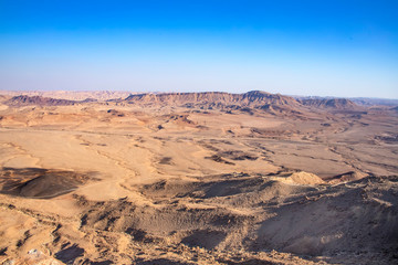 Fototapeta na wymiar View of the sandy hills and mountains of Ramon Crater