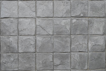 Old Cement Stamp square Pattern grey tone, Rock wall, close up.Abstract Texture background. Grey Stone block pattern Great details, surface for any design.
