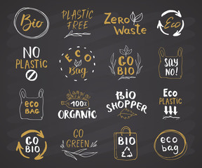 Eco and Bio Hand Drawn labels Set. Calligraphic Letterings with eco friendly sketch doodle elements. Vector illustration on chalkboard background