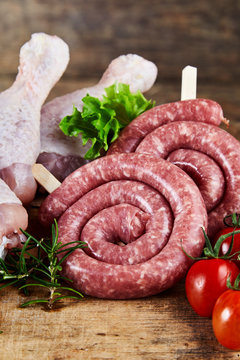Spicy fresh raw kringelwurst with chicken legs