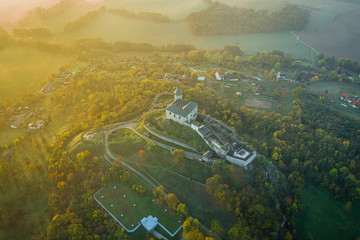 Kunetice Mountain sits in a plain, above which it rises 82 meters (305 m above sea level)....