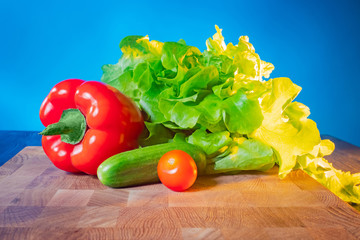 Fresh vegetables are on the table. Wholesome food. Vegetarianism. A raw food diet. The need to eat vegetables every day. Wholesome food. Recipes of vegetable dishes. Still life of vegetables.