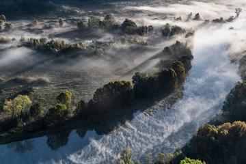 Dawn over the foggy river, Italy landscape