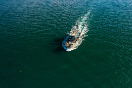 Aerial image of fisherman boat moving on open sea at Kudat, Sabah, Borneo