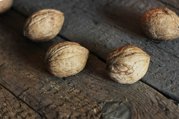 Walnuts on wooden background close up