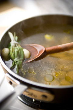 Close up of garlic broth in sauce pan