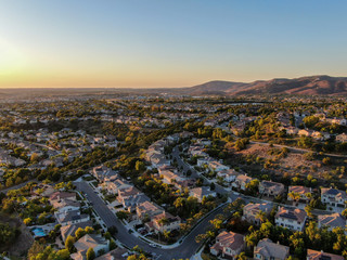 Aerial view of residential modern subdivision luxury house neighborhood during sunset. South California, USA