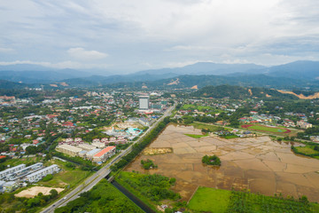 Fototapeta na wymiar Aerial view of beautiful paddy field surrounding by small town at Penampang, Sabah, Borneo 