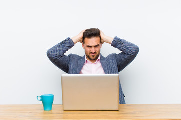 young handsome businessman feeling frustrated and annoyed, sick and tired of failure, fed-up with...