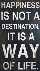 Happiness is nota a destination. It is a way of life text on black board. Motivational, message, text, quotes concept.